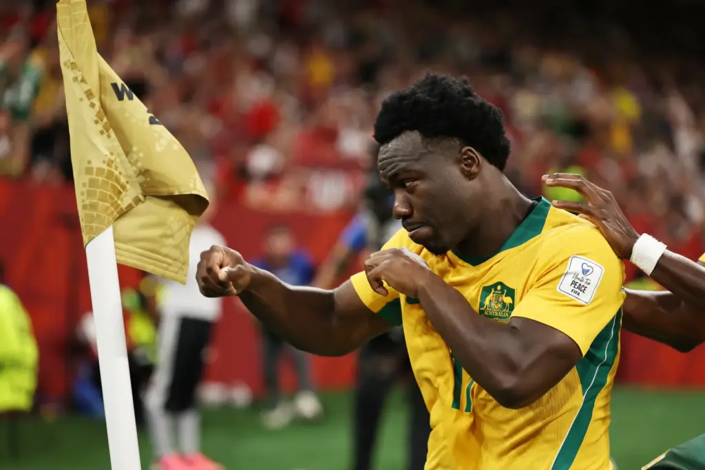 Australia’s Nestory Irankunda (17) celebrates scoring the first goal against...