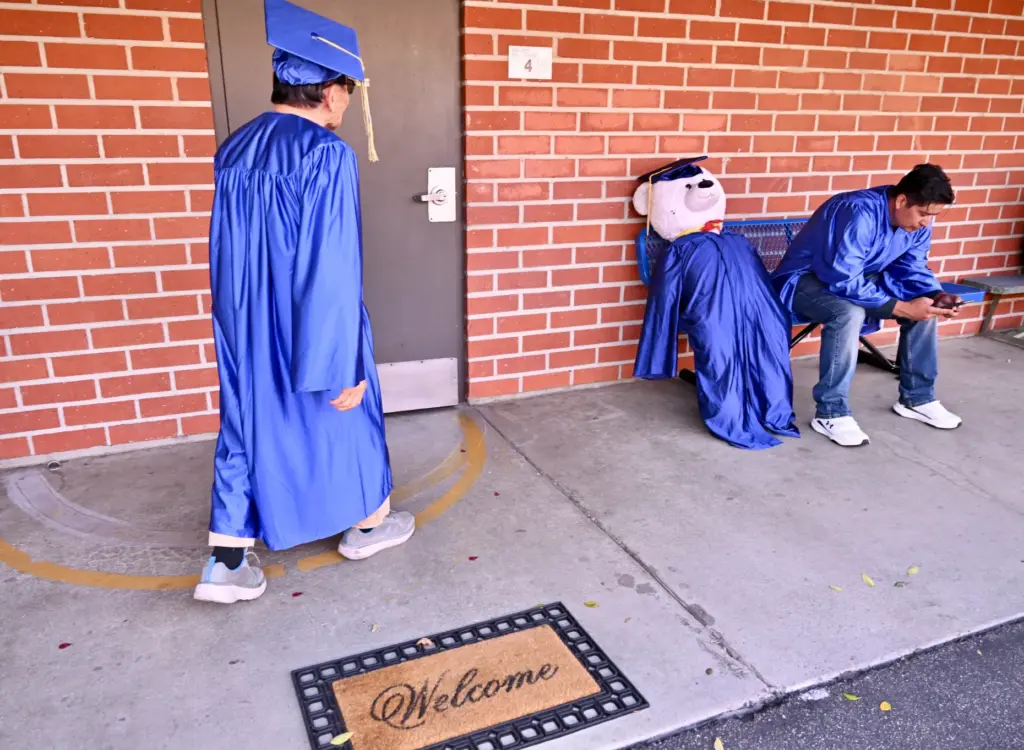 Soo Hak Kwon, 91, makes his way to a room...