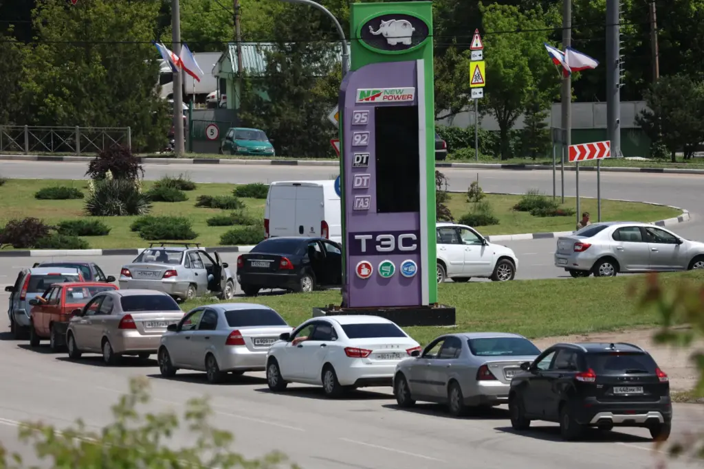 Cars line up at a petrol station in Simferopol, Crimea,...