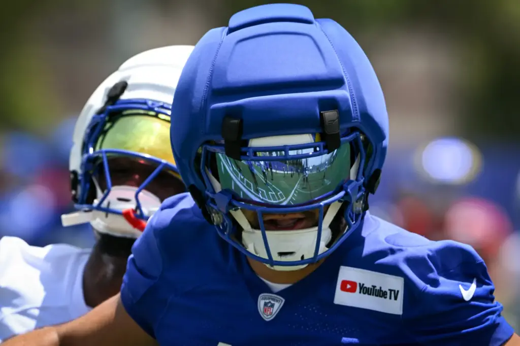 Rams wide receiver Puka Nacua goes through drills during an...