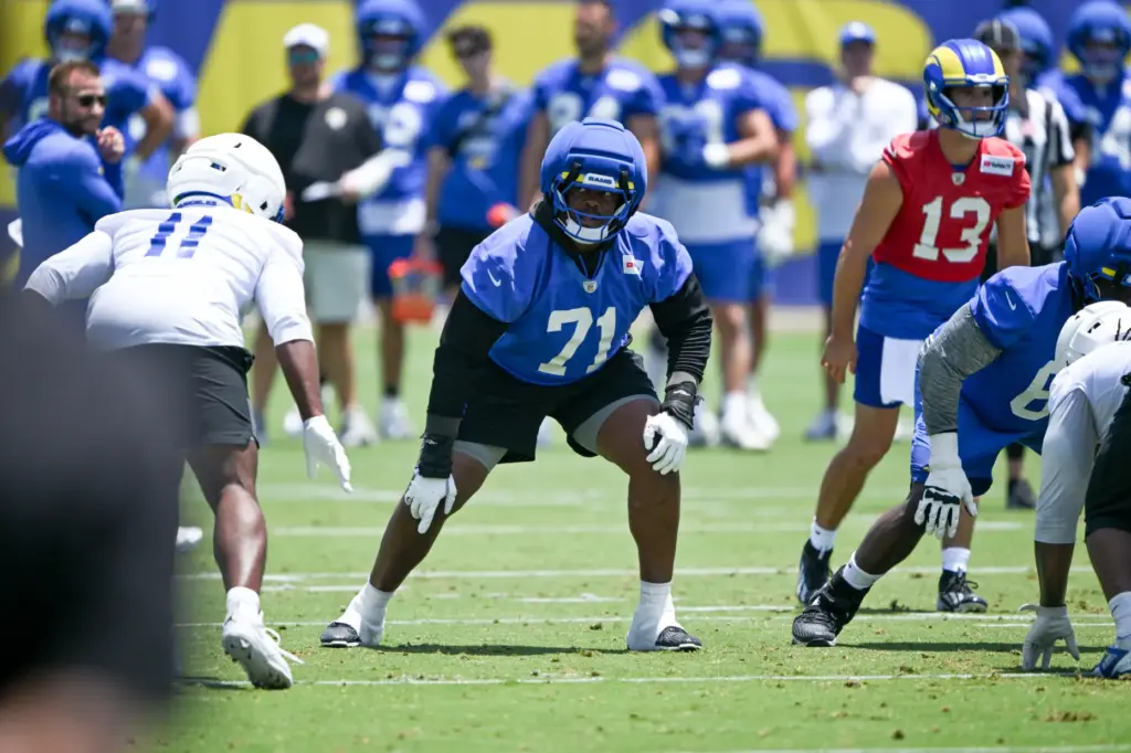 Rams offensive lineman Warren McClendon, Jr. waits for the ball...