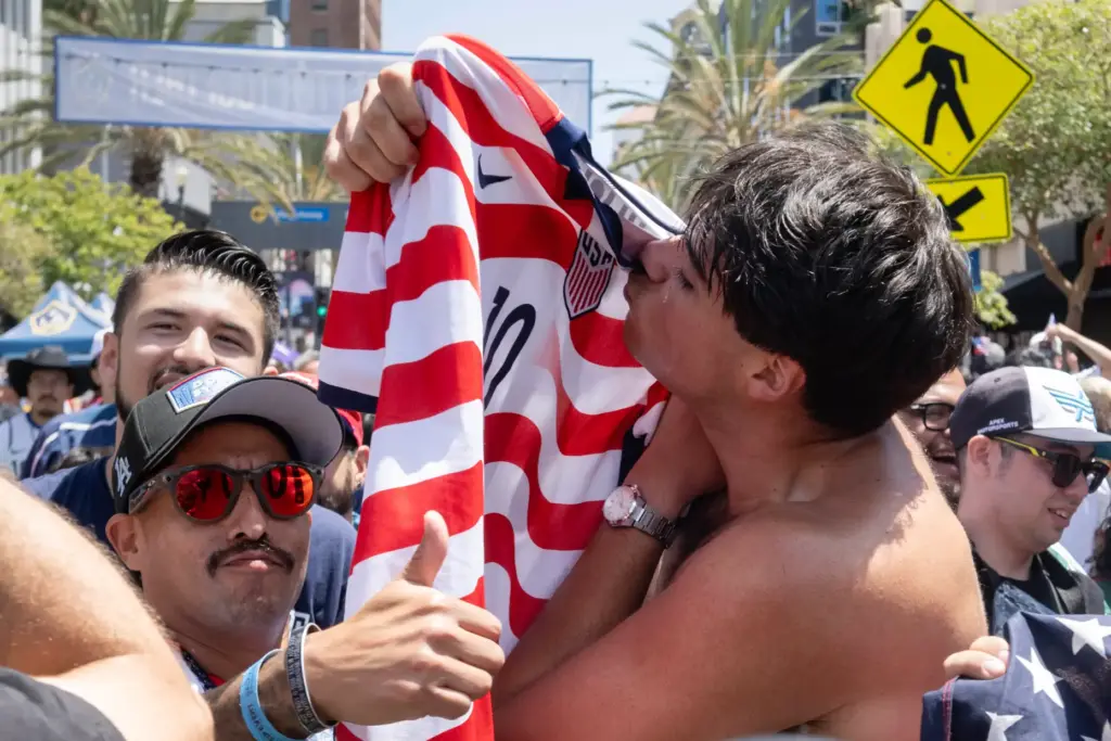 Brandon Suiter kisses his U.S.A. jersey following their win against...