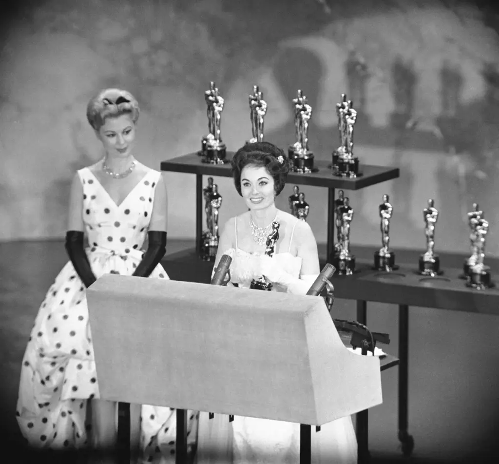 FILE – Actress Ann Blyth, right, holds the Oscar presented...