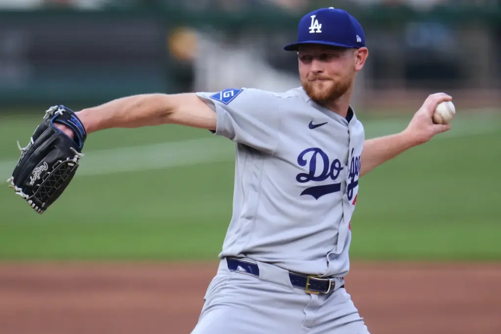 Dodgers starting pitcher Eric Lauer throws to the plate during...