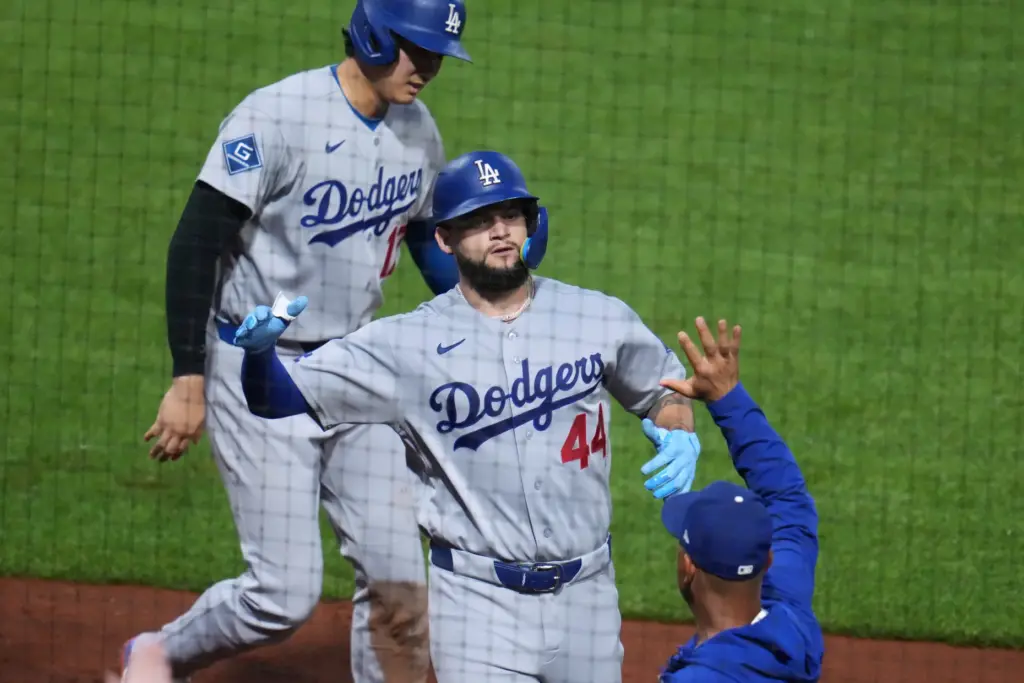 The Dodgers’ Andy Pages (44) is greeted at the dugout...
