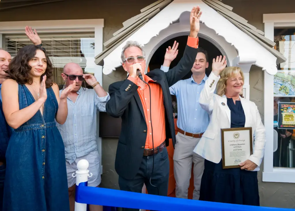 KXFM 104.7 radioâs chairman Billy Fried, center, speaks as he...