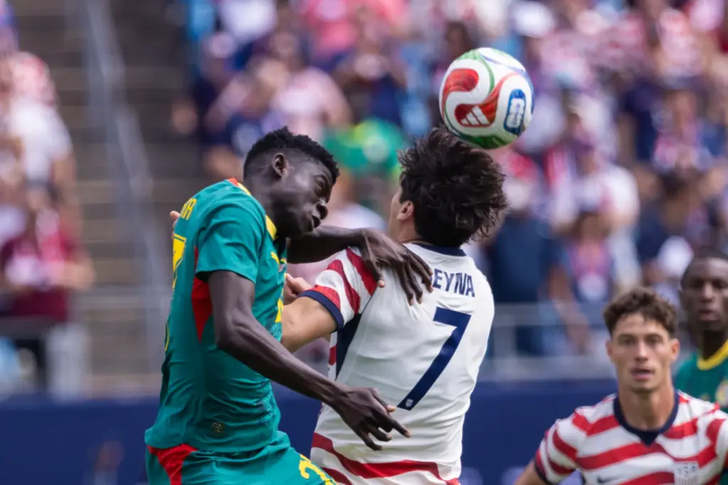 Senegal midfielder Bara Ndiaye, left, and United States midfielder Giovanni...