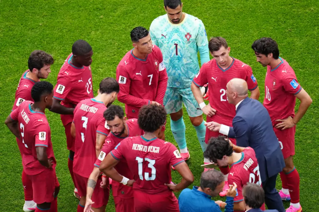 Portugal head coach Roberto Martinez talks during a hydration break.
