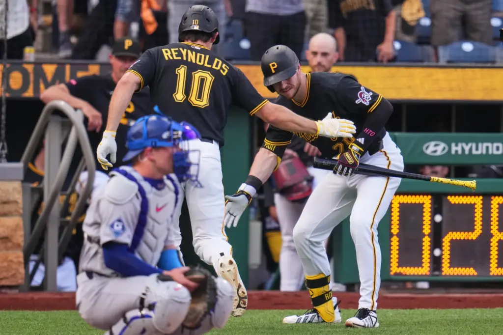 The Pittsburgh Pirates’ Bryan Reynolds (10) celebrates with teammate Ryan...
