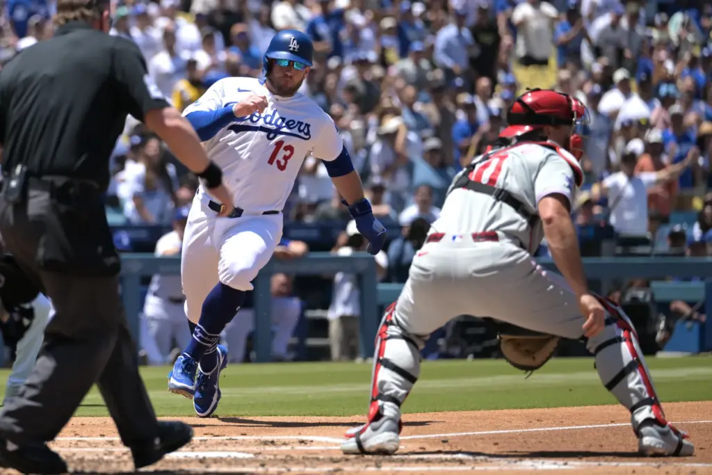 Dodgers’ Max Muncy (13) beats a throw to Philadelphia Phillies...