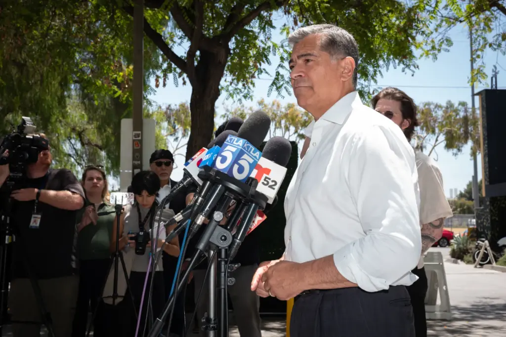 Democratic gubernatorial candidate Xavier Becerra talks with media after meeting...