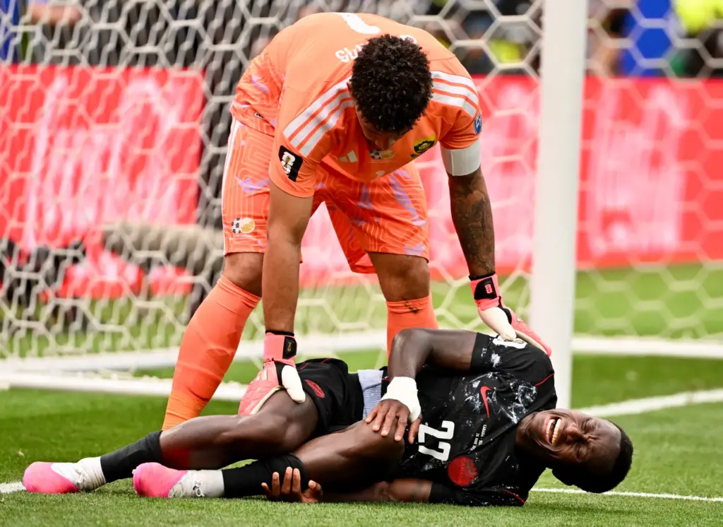 Canada defender Richie Laryea (22) grimaces in pain as South...