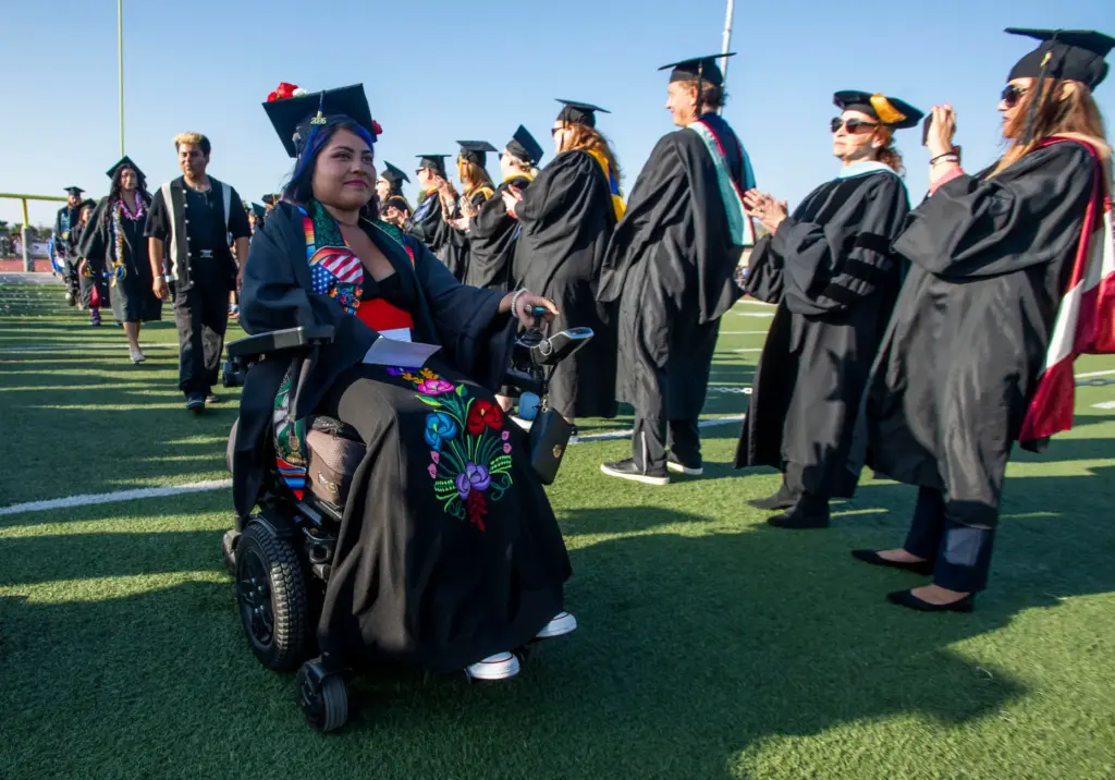 Graduates make their way through a gauntlet of welcoming faculty...