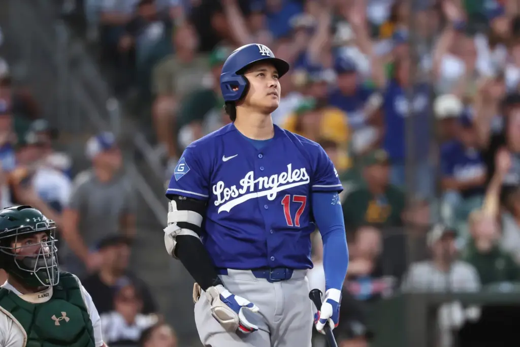 Dodgers star Shohei Ohtani watches the flight of his three-run...