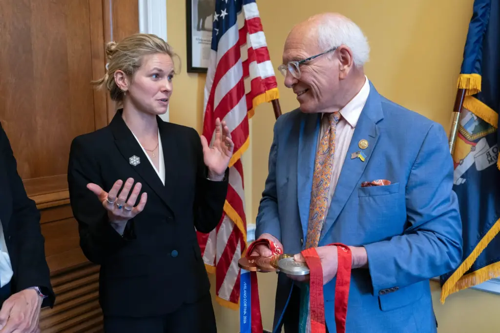 Rep. Paul Tonko, D-N.Y., speaks with Olympian Jessie Diggins as...