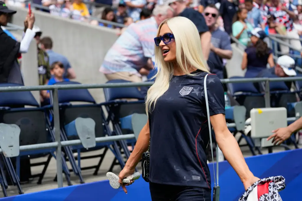 Paris Hilton stands on the pitch before the World Cup...