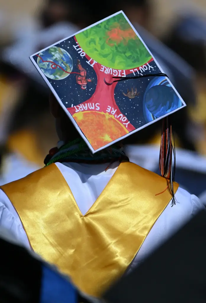 Huntington Beach High School graduates show their creativity by decorating...
