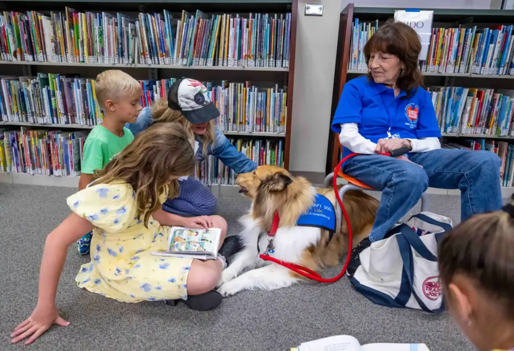 Chloe, 10, of Ladera Ranch, a third grader, reads to...