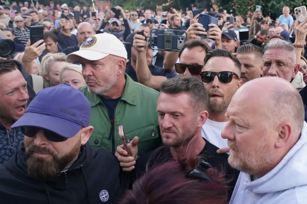 Tommy Robinson attends a protest outside the police station in...