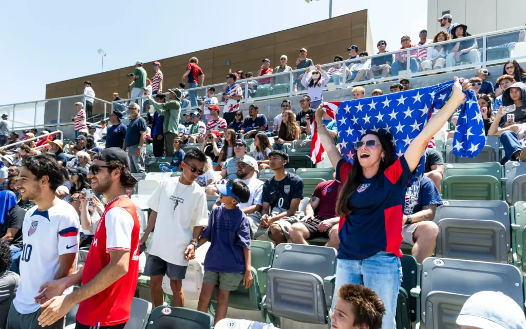 Martha Gray, right, cheers for the U.S. Menâs National Team...