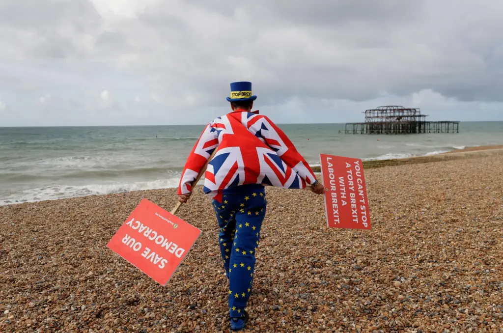 FILE- Anti Brexit campaigner Steve Bray walks on the beach...
