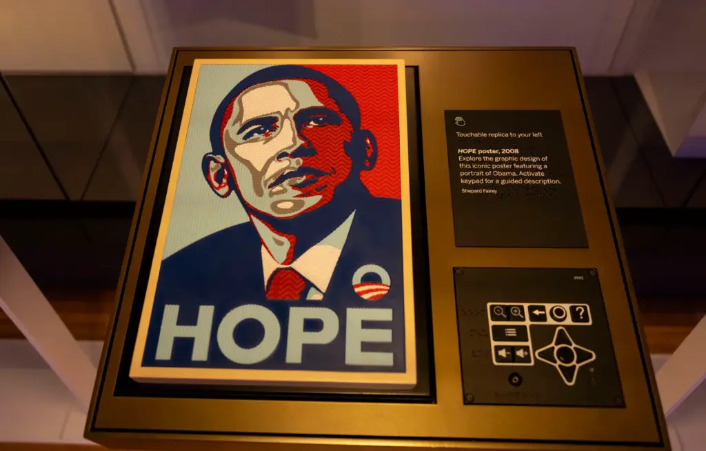 A sensory exhibit invites visitors to touch a reproduction of...