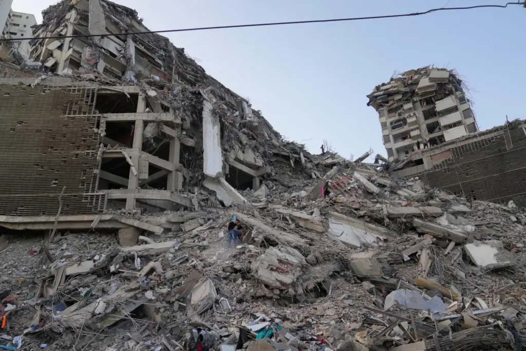 Residents search through the rubble two days after an earthquake...