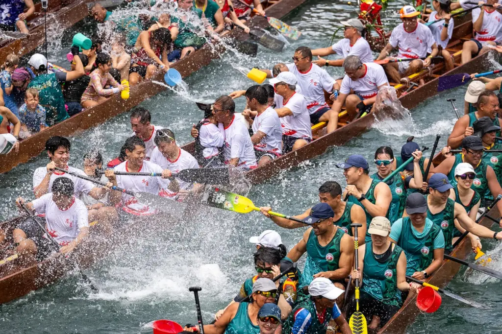 Competitors splash water on each other during the Aberdeen Dragon...