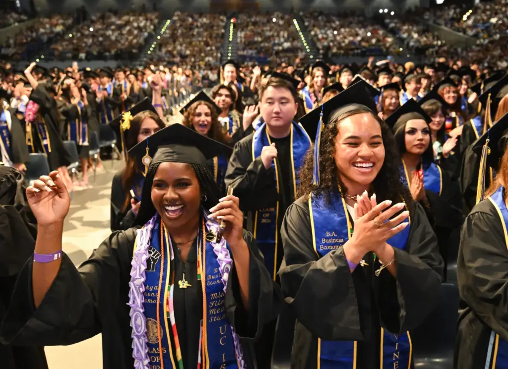 Graduates Nakya Solomon, left, and Halyne Buycks and celebrate during...