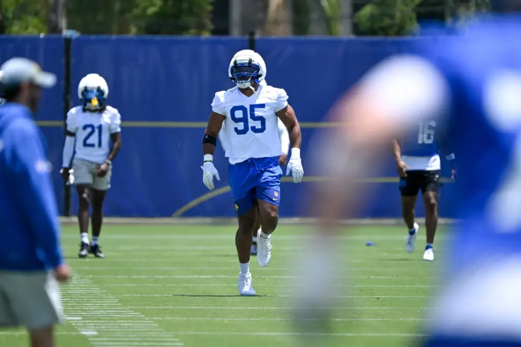 Newly acquired Rams defensive lineman Myles Garrett (95) jogs on...