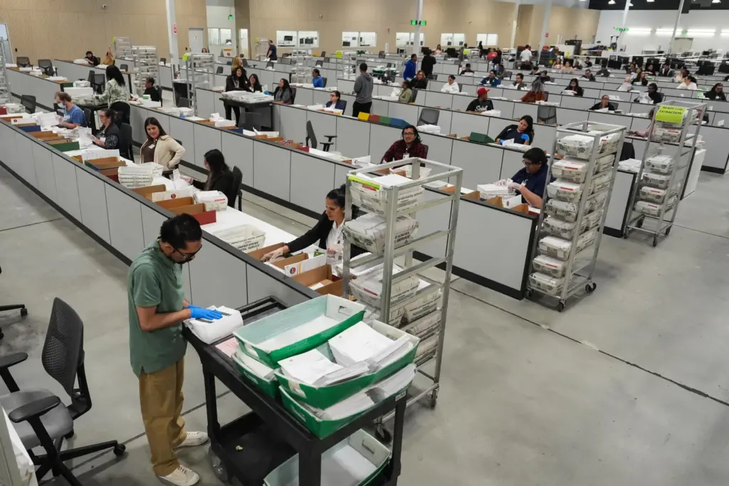Ballots are inspected the day after California’s primary election at...