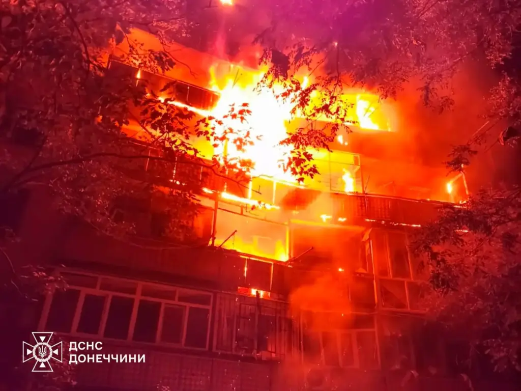 A fire rages in a multistory building after Russia's air attack in Druzhkivka, Ukraine.