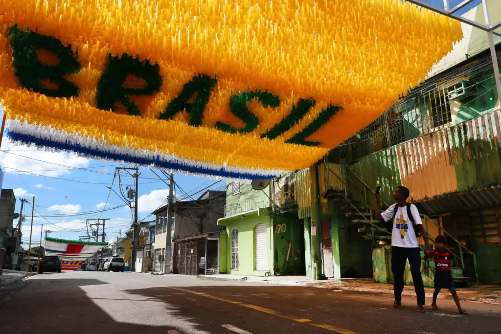 Pedestrians walk beneath street decorations ahead of the 2026 FIFA World Cup, in Manaus, Brazil.