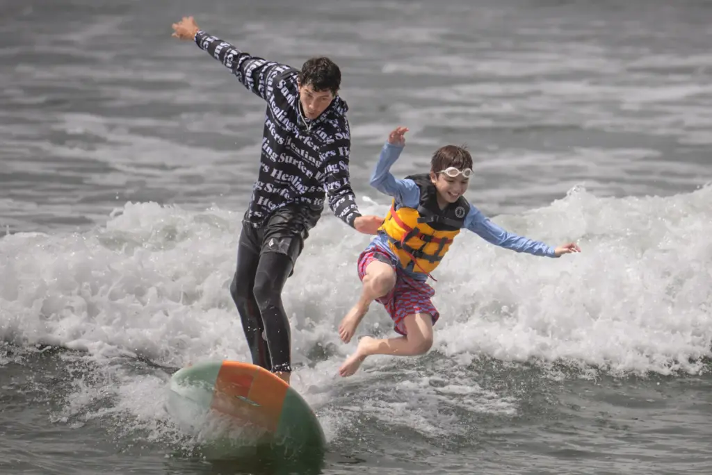 Mattias Gonzalez, 12, bails off the board as Surfers Healing...