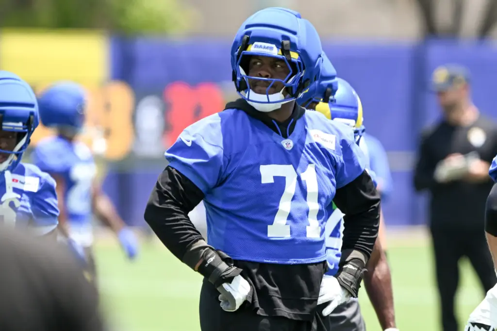 Rams offensive lineman Warren McClendon, Jr. looks on during an...