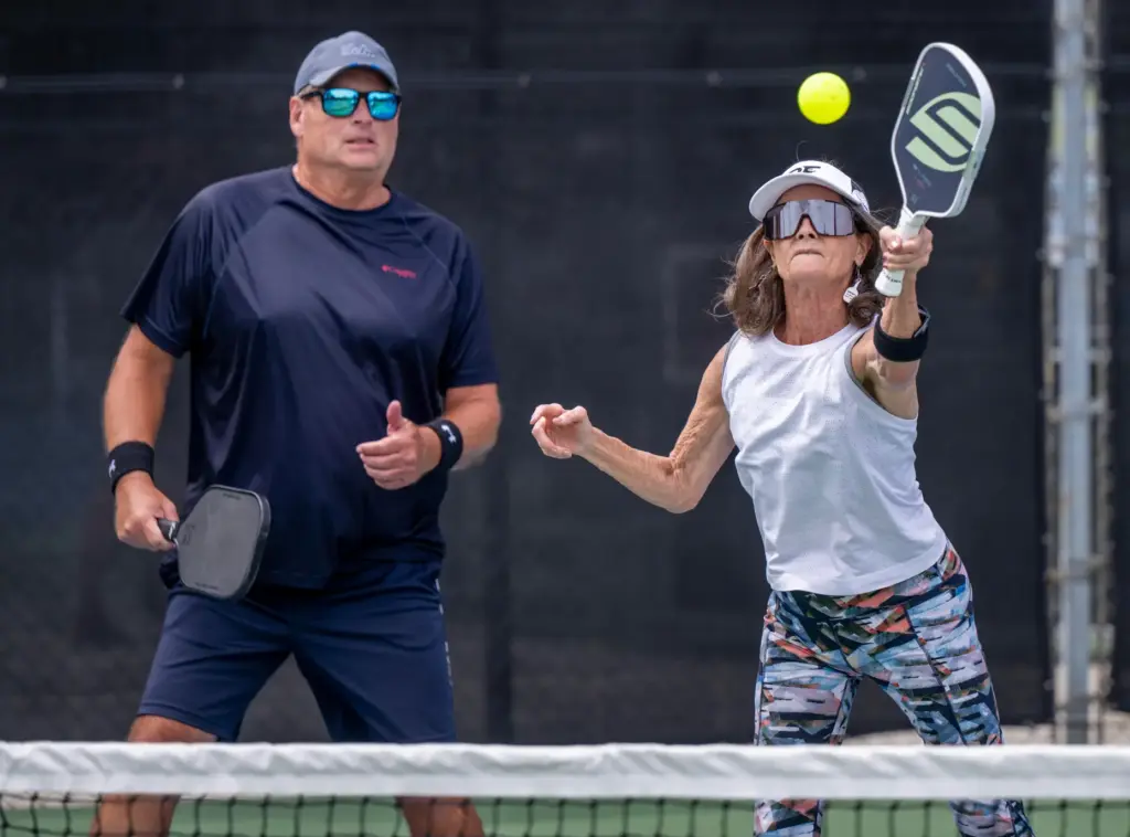 Clare Greene of Capistrano Beach hits the ball while she...