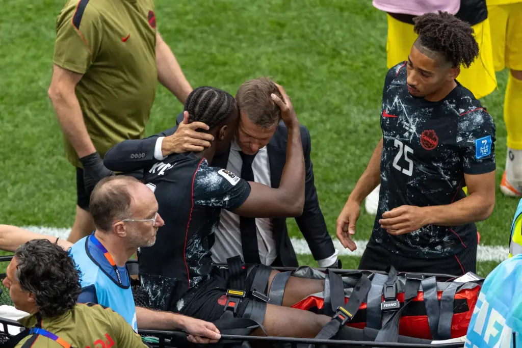 Canada head coach Jesse Marsch embraces Ismael Kone (8) as...