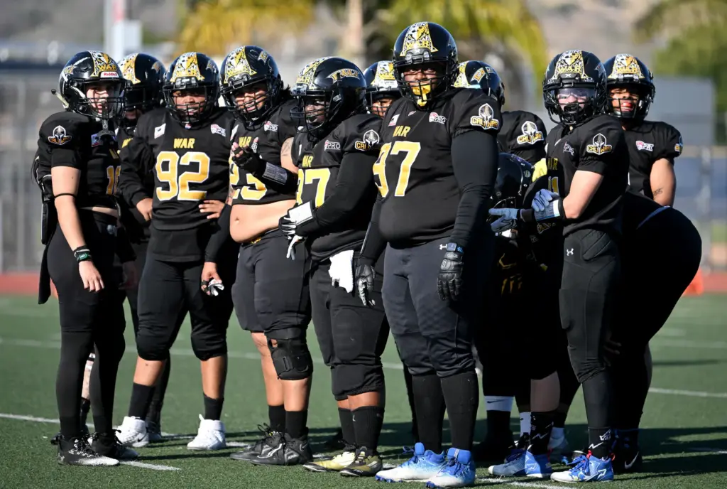 Cali War quarterback Tania Yareli Guzman, left, and her offense...