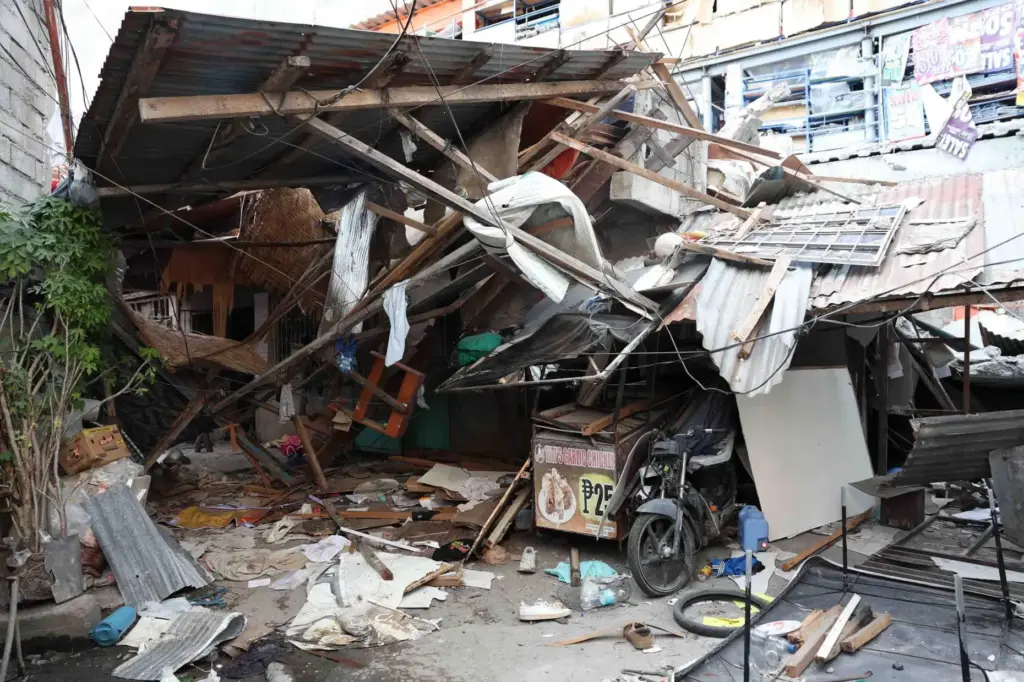 Damaged houses are seen following an earthquake in General Santos,...
