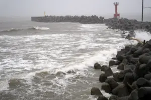 2 tropical storms pound Japan with floods and landslides, killing 1