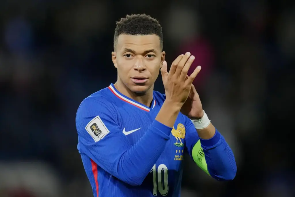 FILE – France’s Kylian Mbappe celebrates after winning a World...