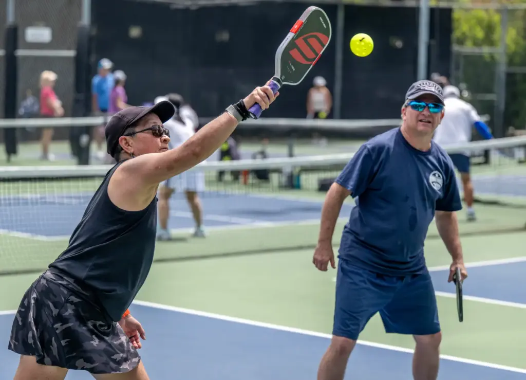 Michelle Darrow of Laguna Niguel hits the ball while she...