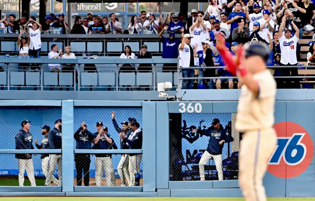 The Dodger bullpen along with fans react after Ryan Ward...