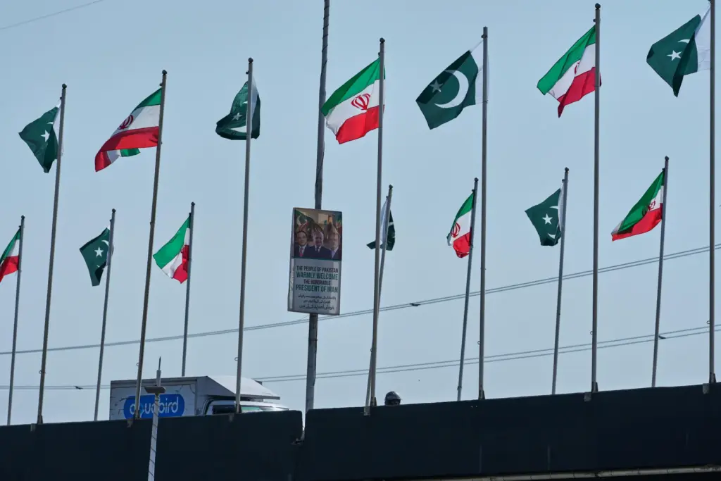 A welcoming billboard among Iranian flags in Islamabad, Pakistan.