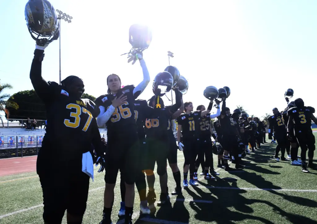 Cali War team members line up for the national anthem...