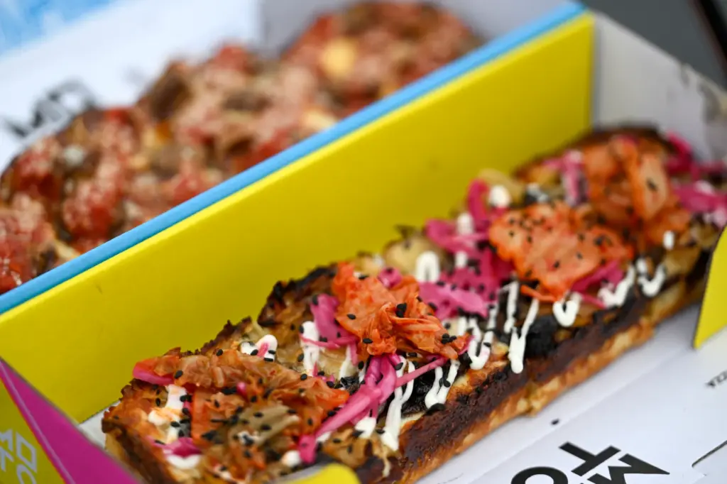 The Kissed pizza (spicy sausage, pepperoni and hot honey pizza)...