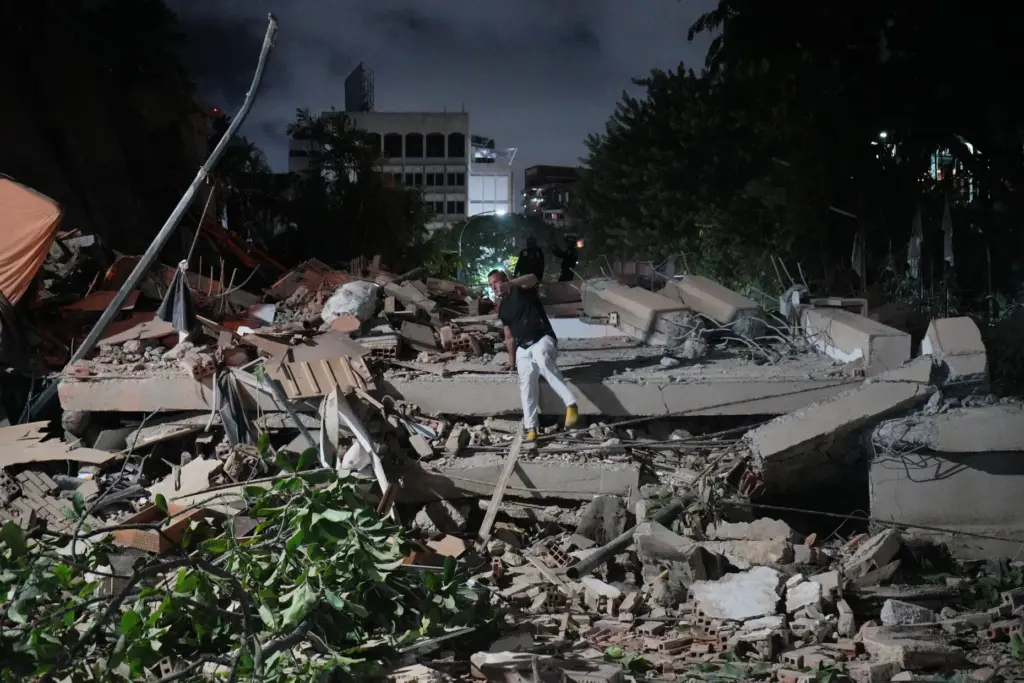 A man jumps on a collapsed building after an earthquake...