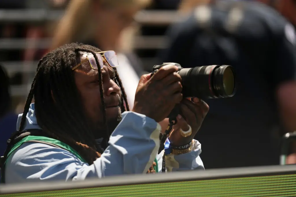 Former Seattle Seahawks and NFL player Marshawn Lynch takes pictures...