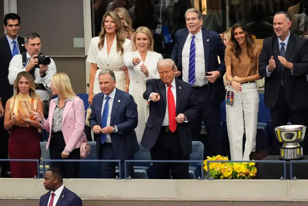 FILE – President Donald Trump, center, attends the men’s singles...