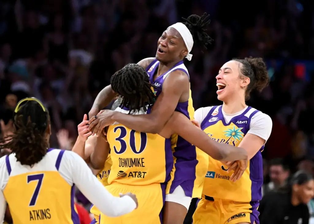 Los Angeles Sparks Nneka Ogwumike (30) is hugged by her...
